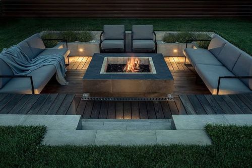 backyard fire pit in sunken lounge area with outdoor couches