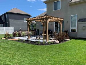 Backyard Pergola with Mulch Garden