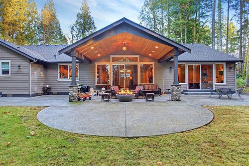 patio with attached covered roof with lighting