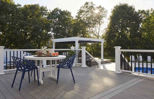 modern deck with stairs and black and white railings