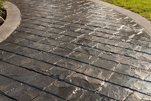 black stamped concrete pathway