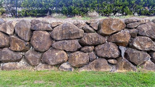 retaining wall made of large natural boulders