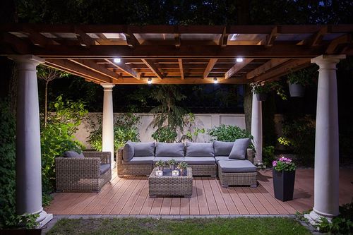 freestanding wooden pergola with pillars supporting the four corners