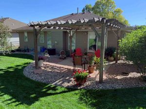 Backyard Pergola with Rock Garden