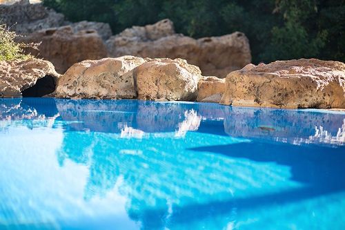 pool with boulder border