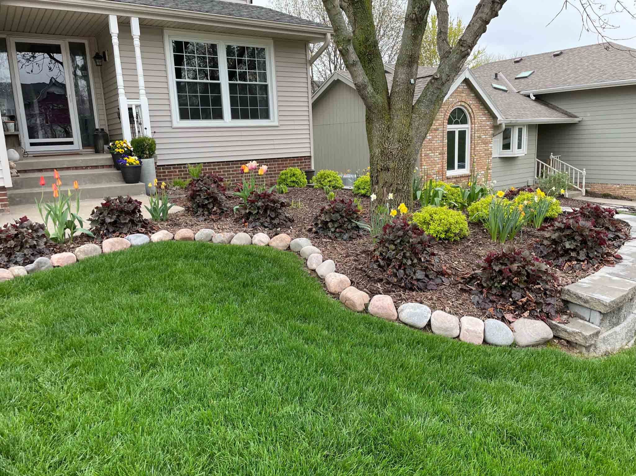 front yard landscape garden with mulch and flowers