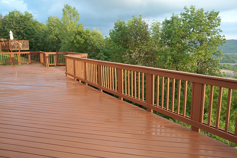 custom natural chestnut wood deck with railings